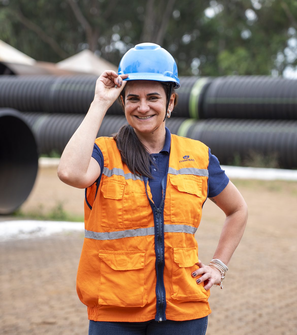 Itaminas employee wearing a hard hat and safety vest at the operation
